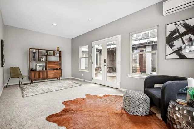 a living room with furniture window and wooden floor