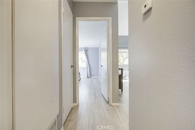a view of a bathroom from a hallway
