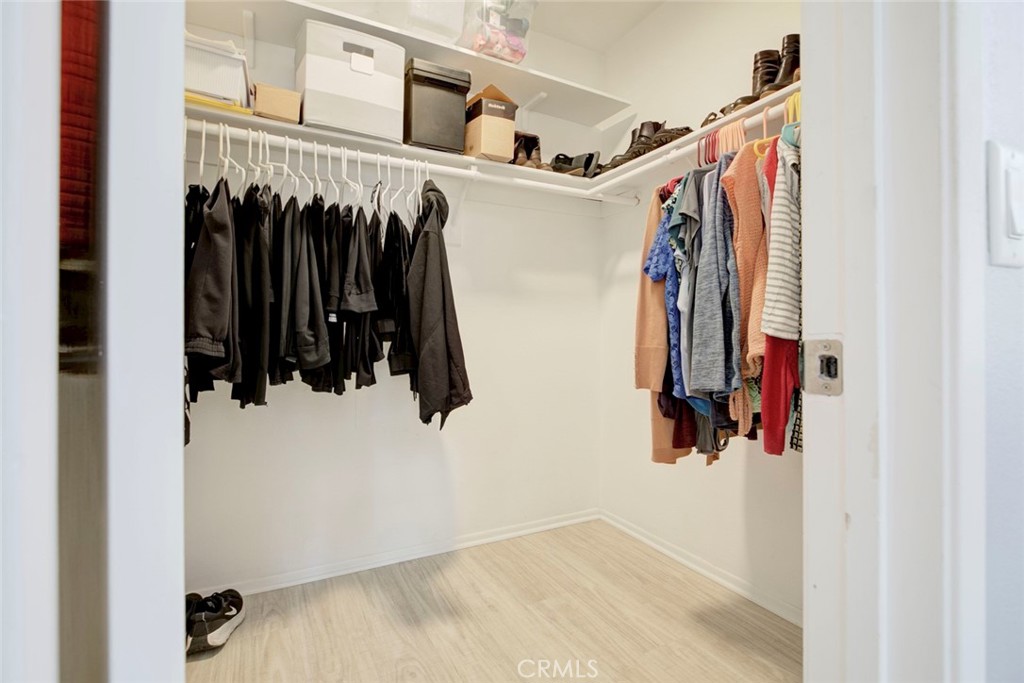 27620 Susan Beth Way, Unit L Saugus, CA 91350 - Photo 18 of 26 a view of walk in closet with clothes and shoes