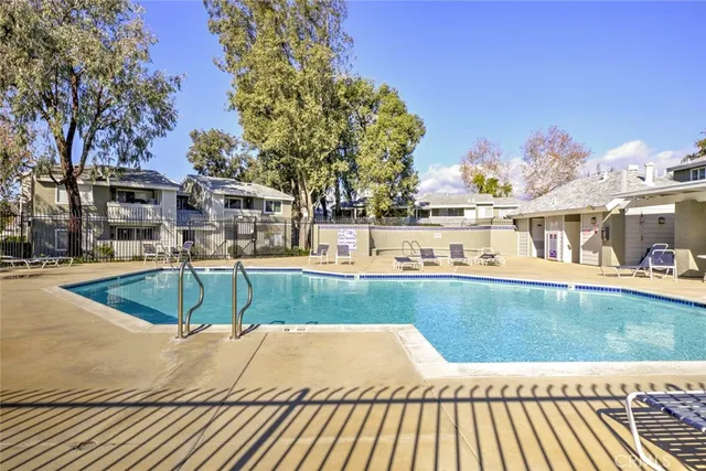 a view of a swimming pool with a patio