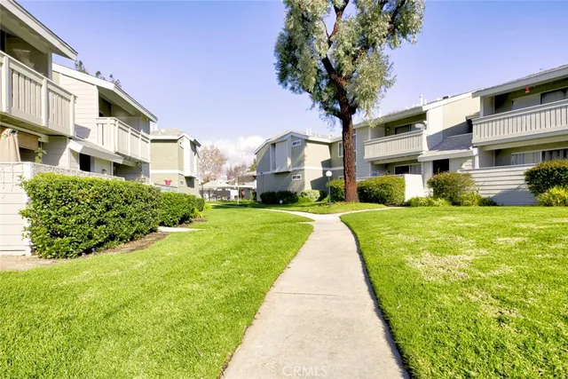 a front view of a building with a yard