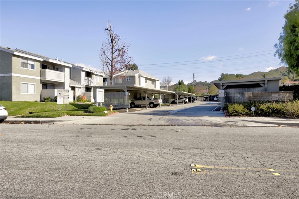 27620 Susan Beth Way, Unit L Saugus, CA 91350 - Photo 25 of 26 a cars parked on the side of a street