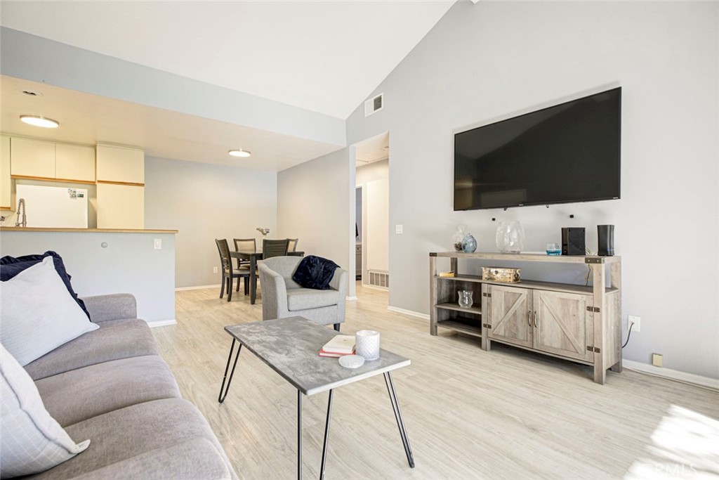 27620 Susan Beth Way, Unit L Saugus, CA 91350 - Photo 5 of 26 a living room with furniture and a flat screen tv