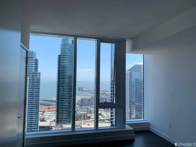 a view of a room that has a large window
