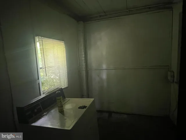 a bathroom with a sink and a window