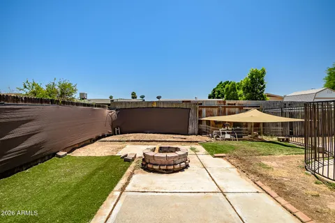 a view of swimming pool with seating area and furniture