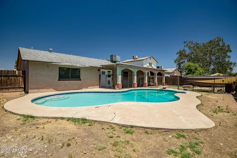 a view of outdoor space yard and swimming pool