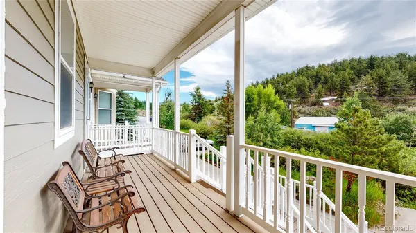 a view of a balcony with wooden floor