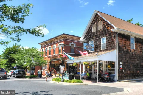 a view of street with stores