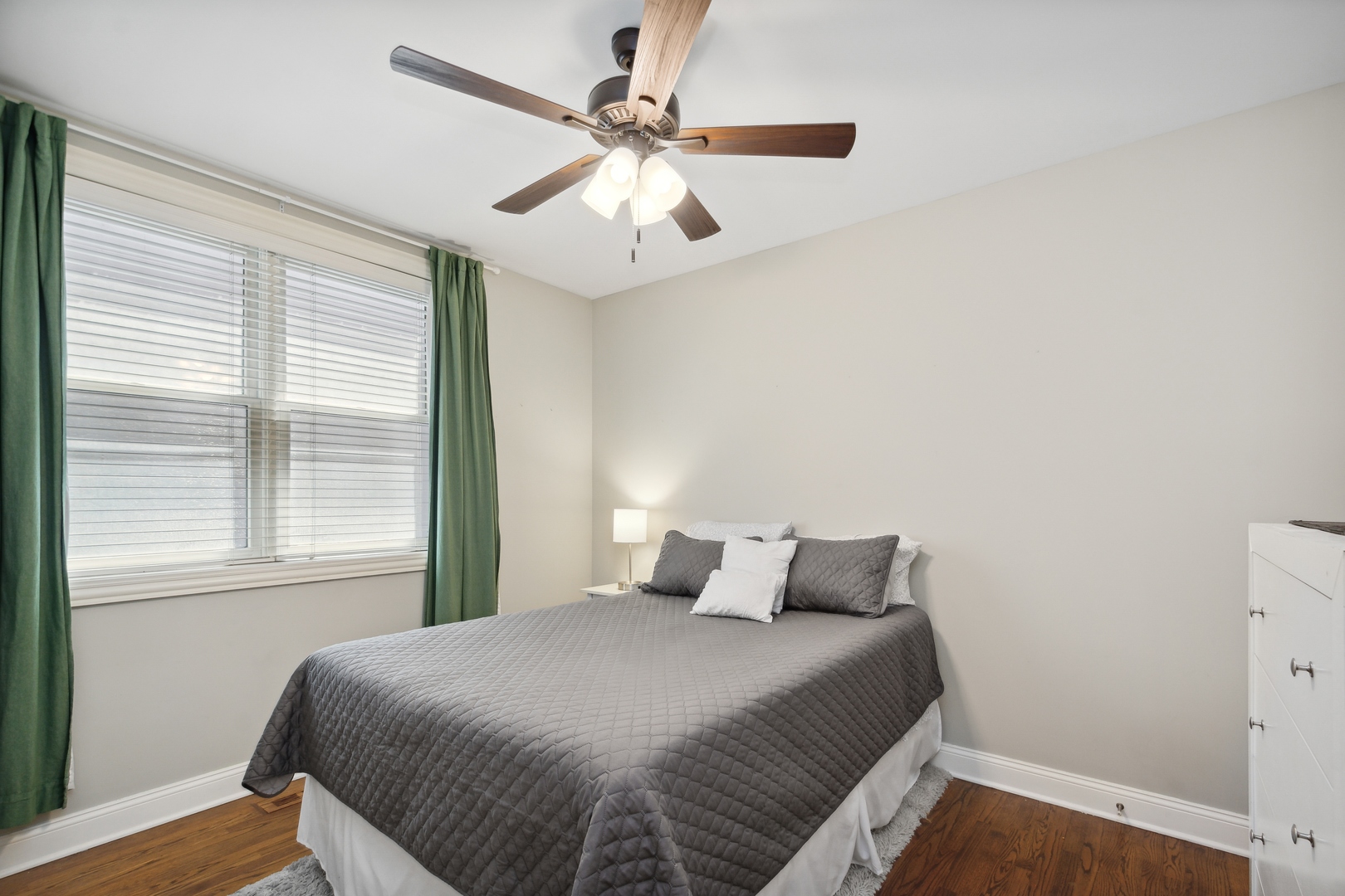 2147 West Rice Street, Unit 2E Chicago, IL 60622 - Photo 12 of 16 a bedroom with a bed and a window