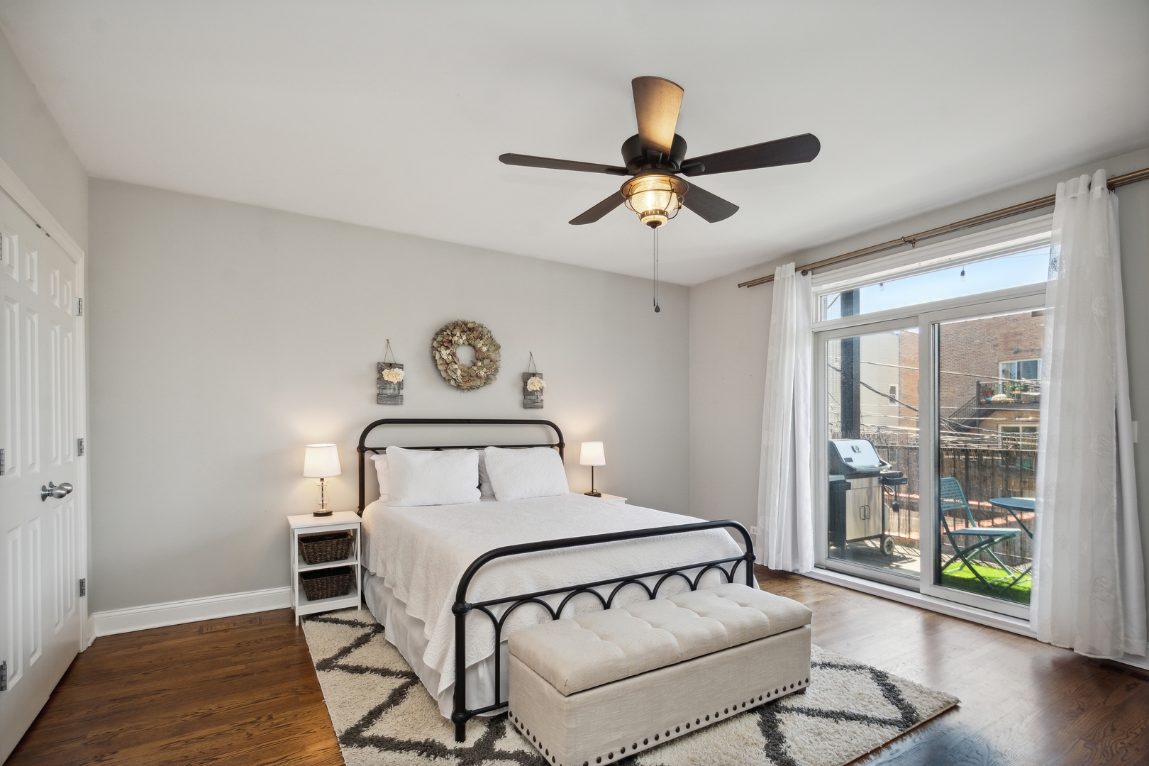 2147 West Rice Street, Unit 2E Chicago, IL 60622 - Photo 8 of 16 a bedroom with a bed and wooden floor