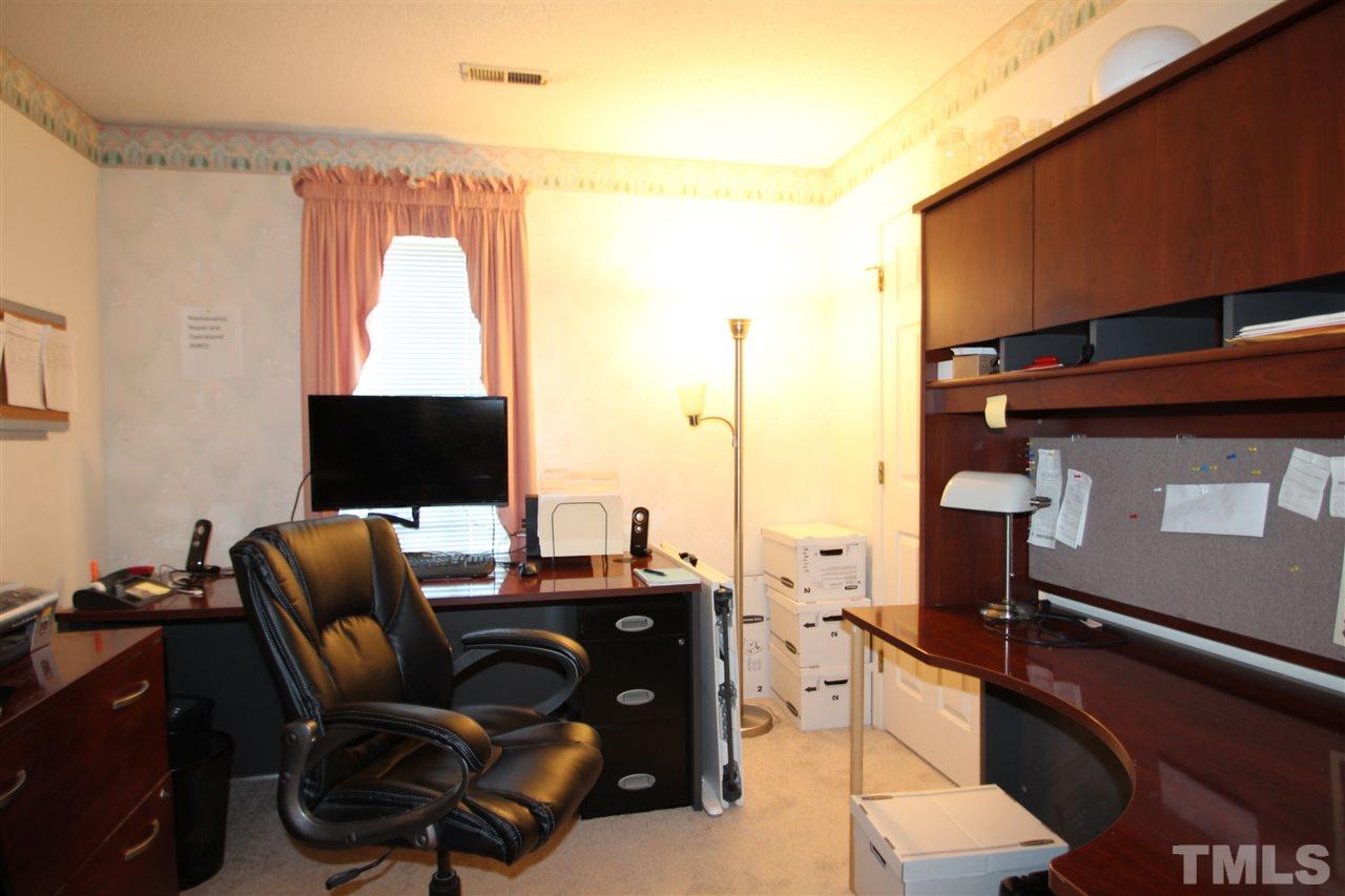 11833 North Exeter Way Raleigh, NC 27613 - Photo 11 of 16 a view of workspace with lounge chair