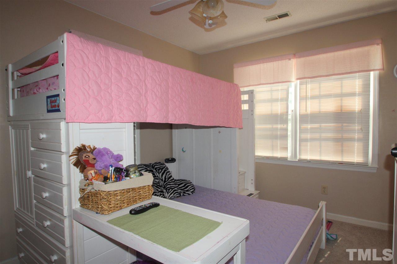 11833 North Exeter Way Raleigh, NC 27613 - Photo 12 of 16 a room with furniture and a window