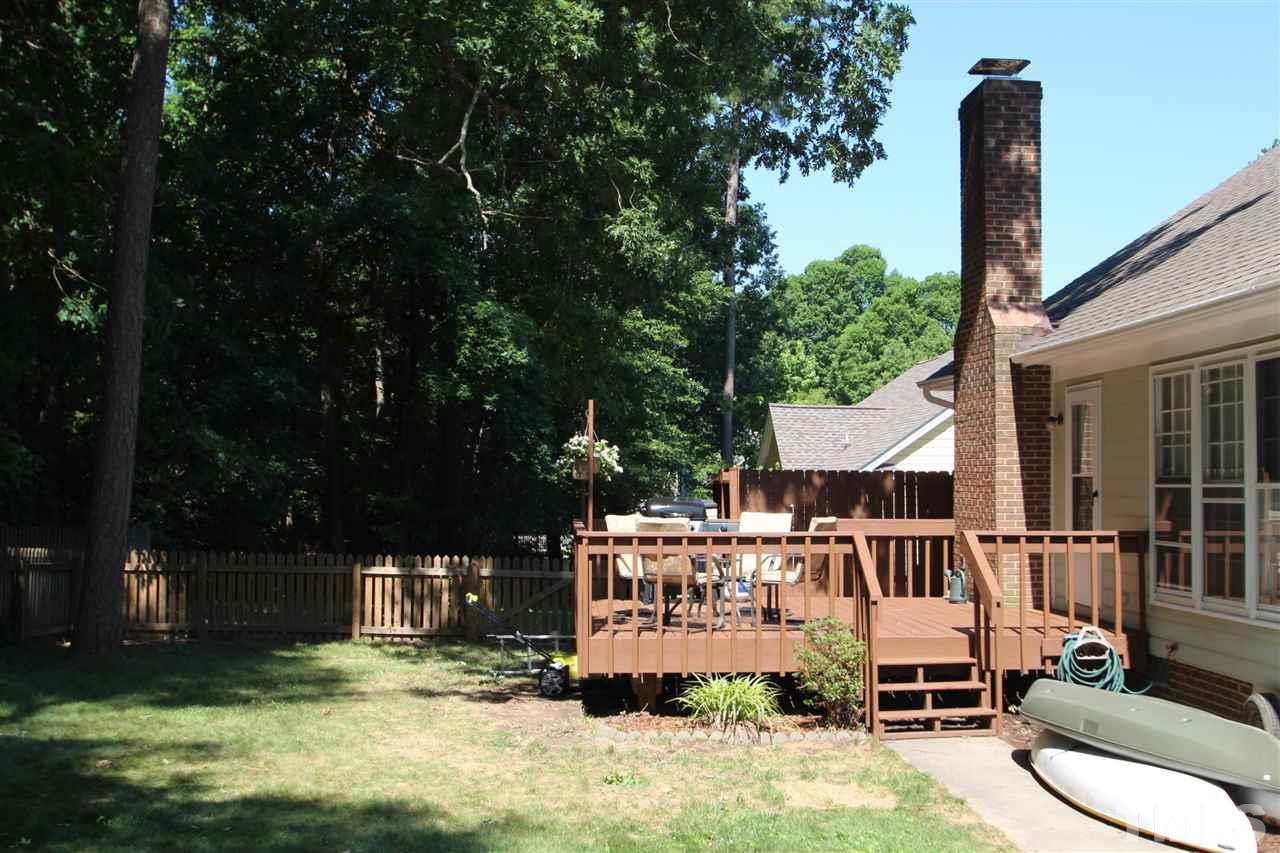 11833 North Exeter Way Raleigh, NC 27613 - Photo 16 of 16 a view of a chair and tables in the patio