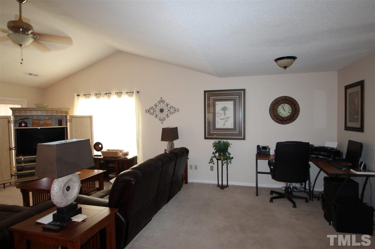 11833 North Exeter Way Raleigh, NC 27613 - Photo 3 of 16 a living room with furniture