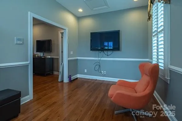 a room with furniture and wooden floor