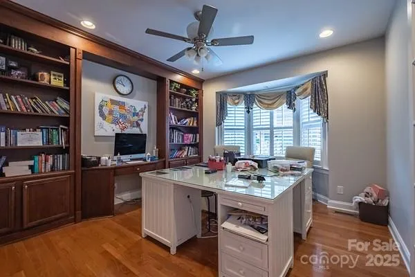 a kitchen with a stove a refrigerator and a dining table