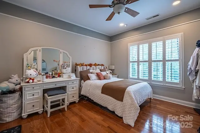 a bed room with a bed and a window