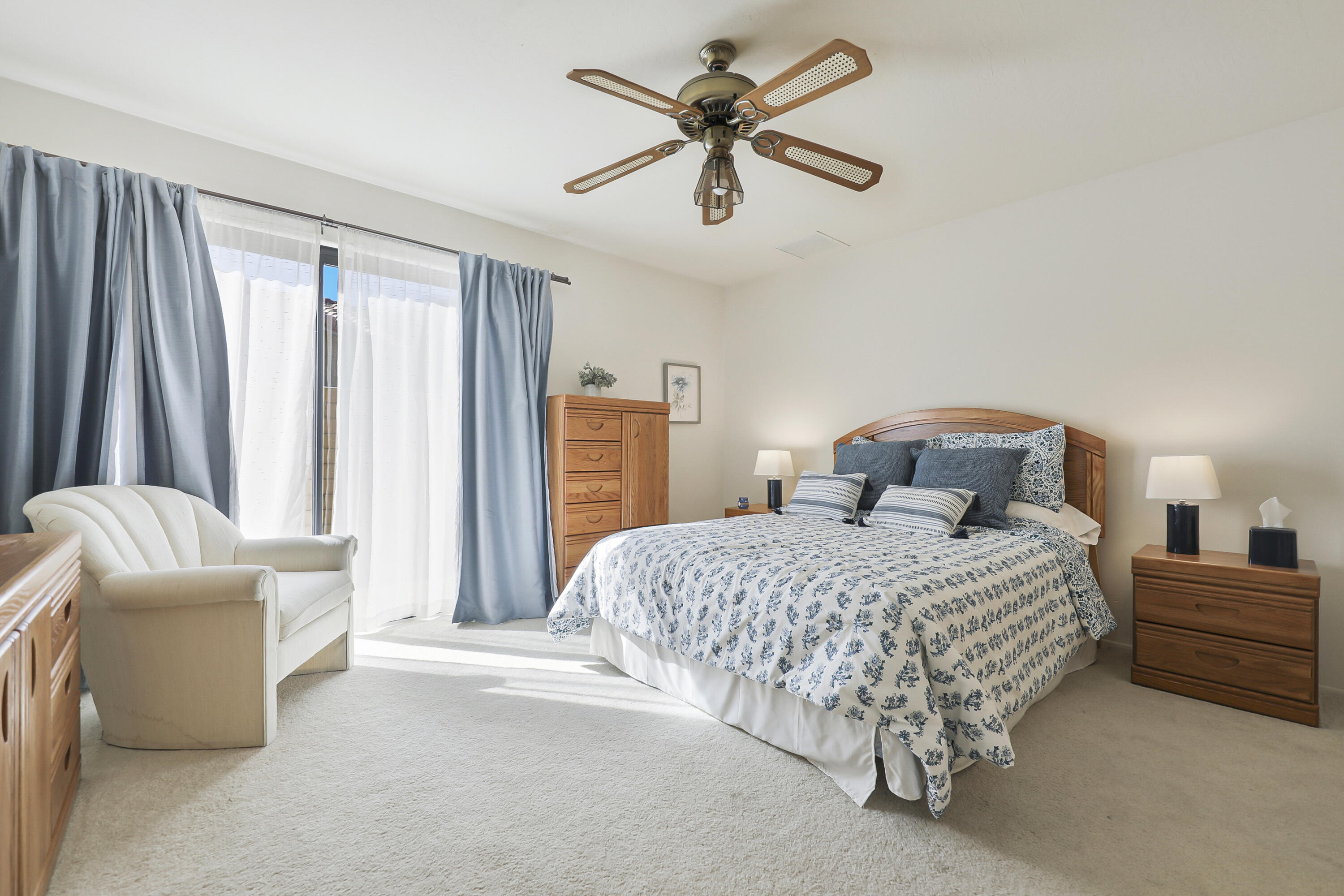 79170 Starlight Lane Bermuda Dunes, CA 92203 - Photo 19 of 33 a bedroom with a bed and a chandelier