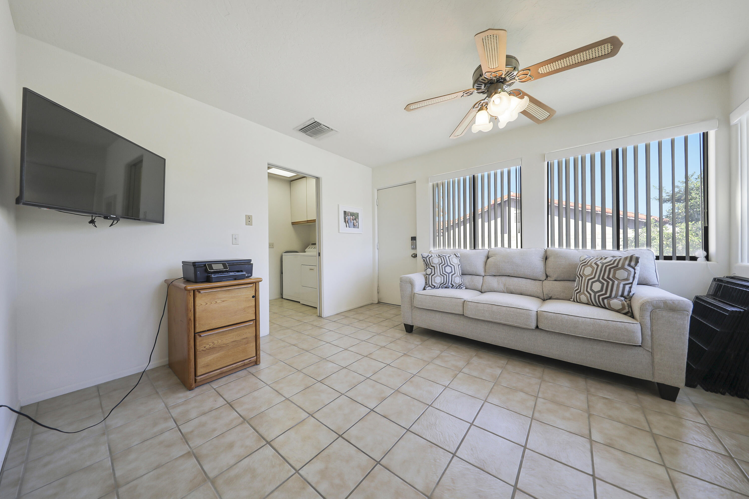 79170 Starlight Lane Bermuda Dunes, CA 92203 - Photo 20 of 33 a living room with furniture and a flat screen tv