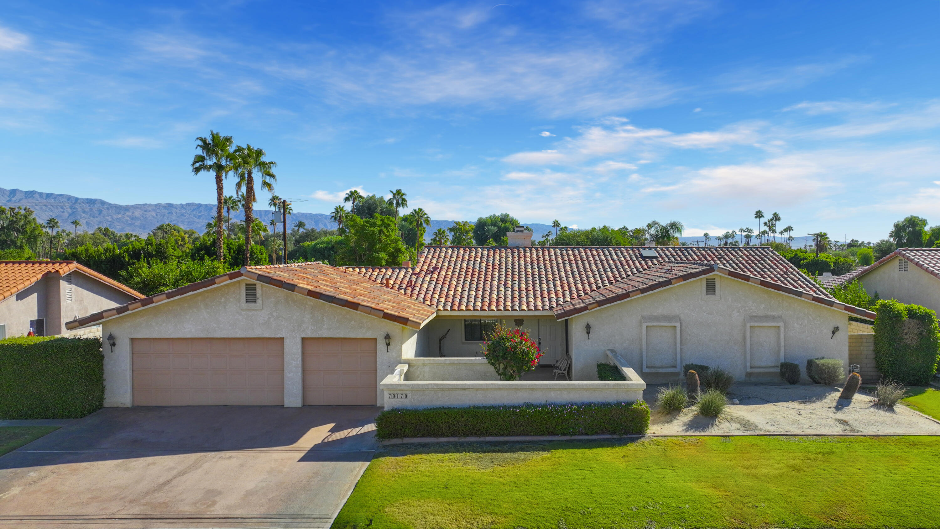 79170 Starlight Lane Bermuda Dunes, CA 92203 - Photo 2 of 33 a front view of house with garden and trees