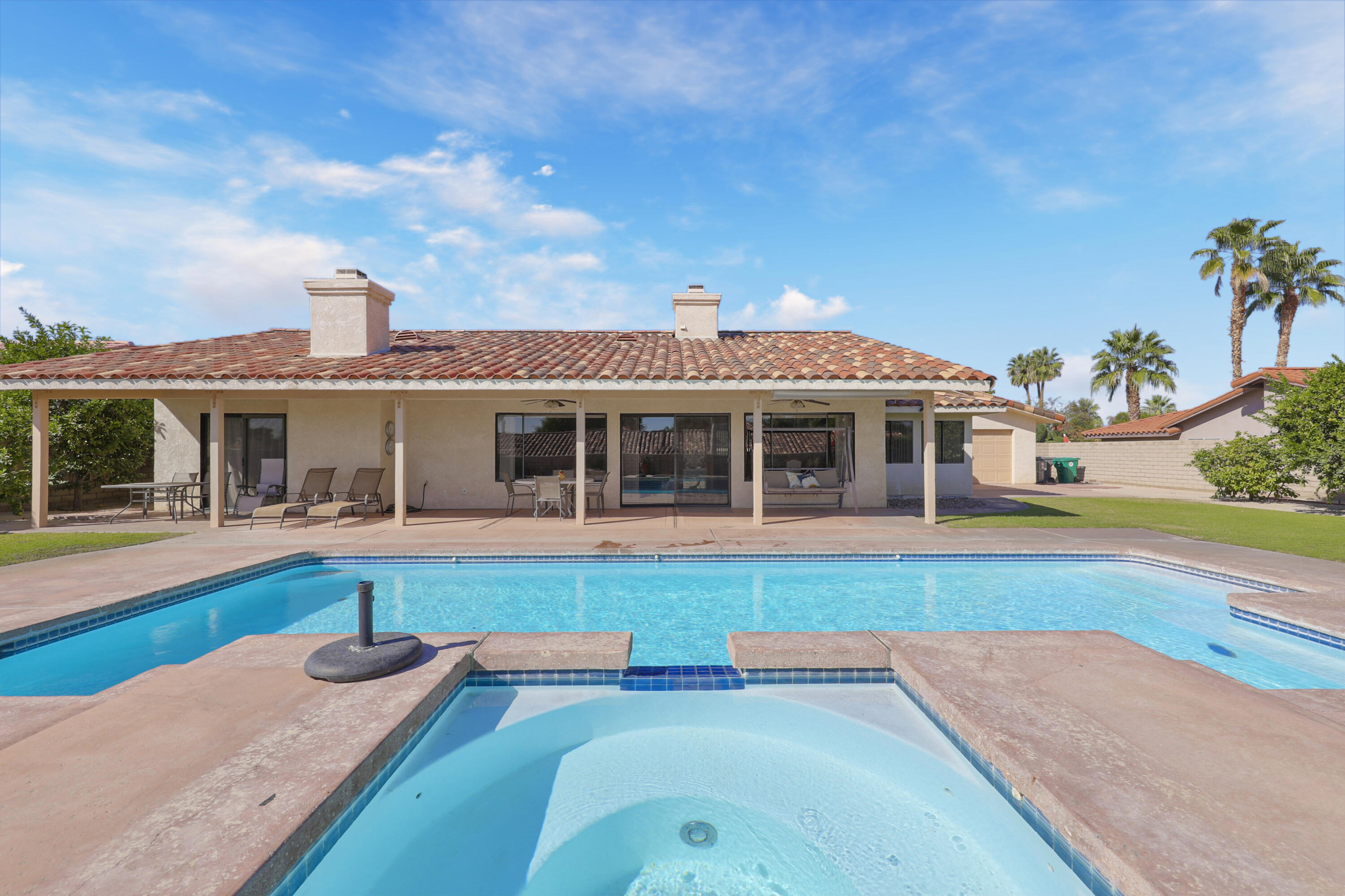 79170 Starlight Lane Bermuda Dunes, CA 92203 - Photo 28 of 33 a front view of house with yard and outdoor seating