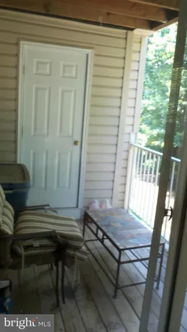 a sitting area with furniture and a window