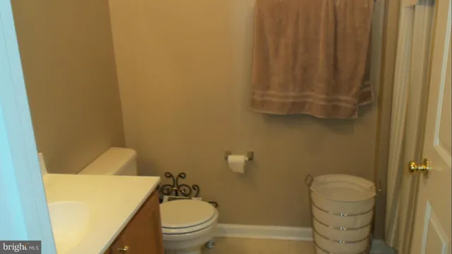 a bathroom with a toilet and a sink