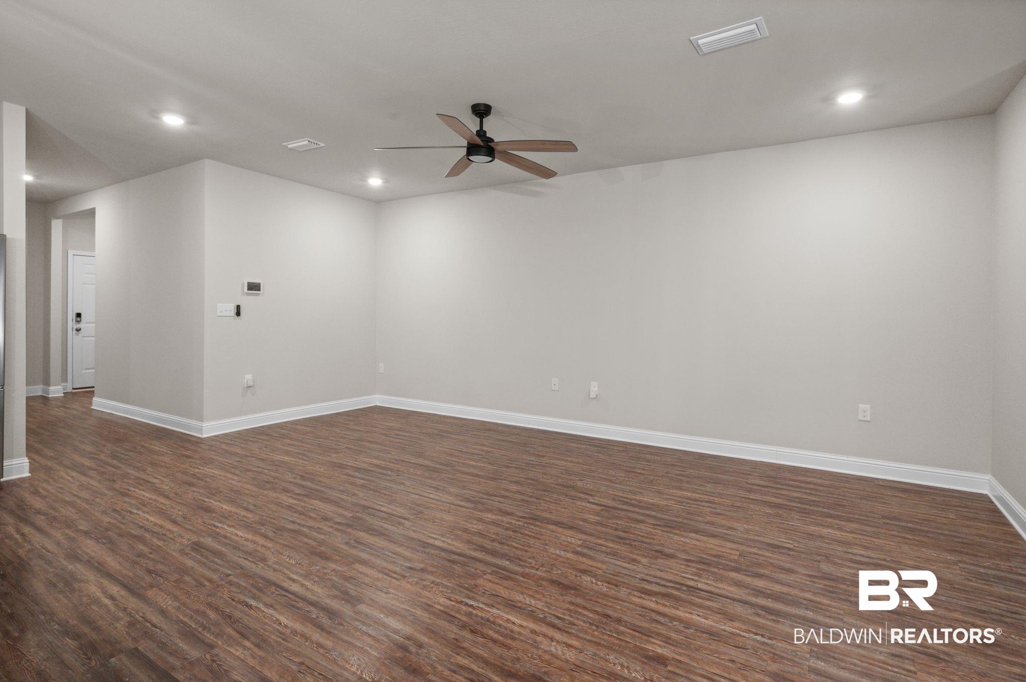 24769 Slater Mill Road Daphne, AL 36526 - Photo 13 of 38 Spare room featuring ceiling fan and dark hardwood / wood-style flooring