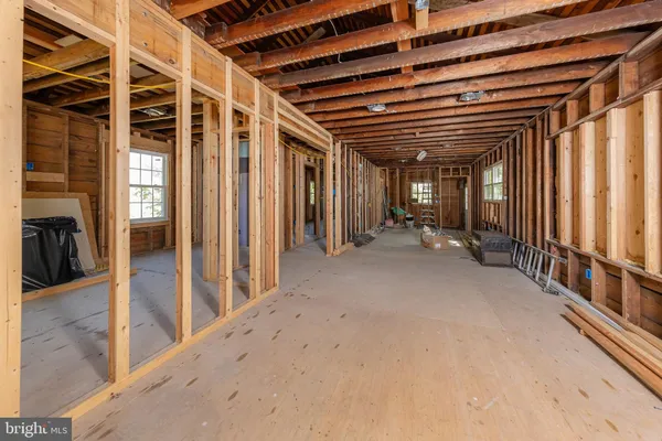 a view of a livingroom with furniture and a window