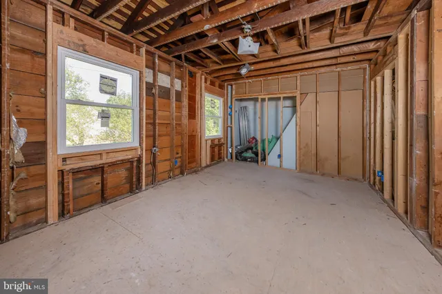 an aerial view of a yard with a barn