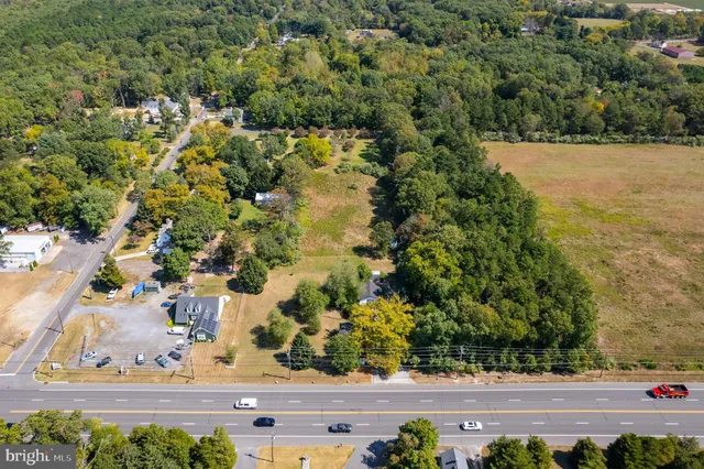 an aerial view of a houses with yard
