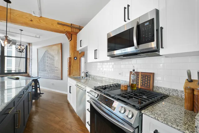 a kitchen with a stove and a microwave