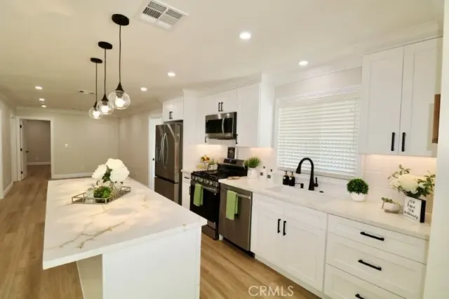 a view of a storage & utility room with washer and dryer