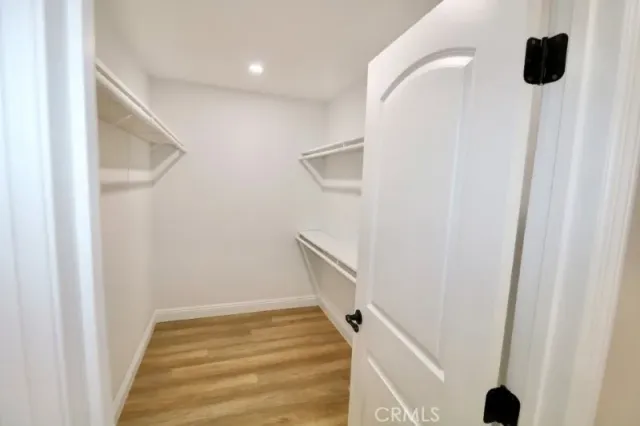 a bathroom with a double vanity sink and toilet