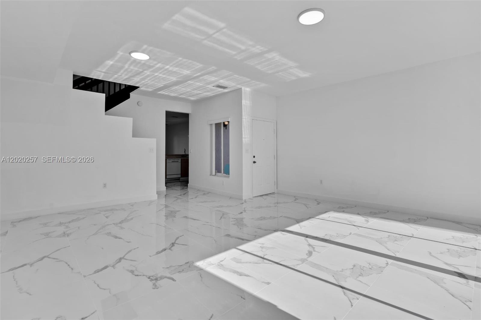 10245 Southwest 154th Place, Unit 1123 Miami, FL 33196 - Photo 17 of 38 an empty room with kitchen view
