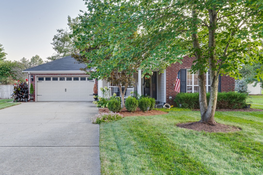 908 Chesire Court White House, TN 37188 - Photo 1 of 20 a front view of a house with a yard