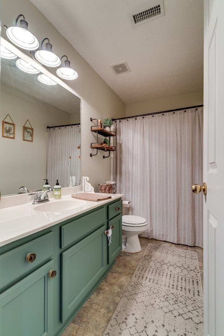 908 Chesire Court White House, TN 37188 - Photo 14 of 20 a bathroom with a double vanity sink and a mirror