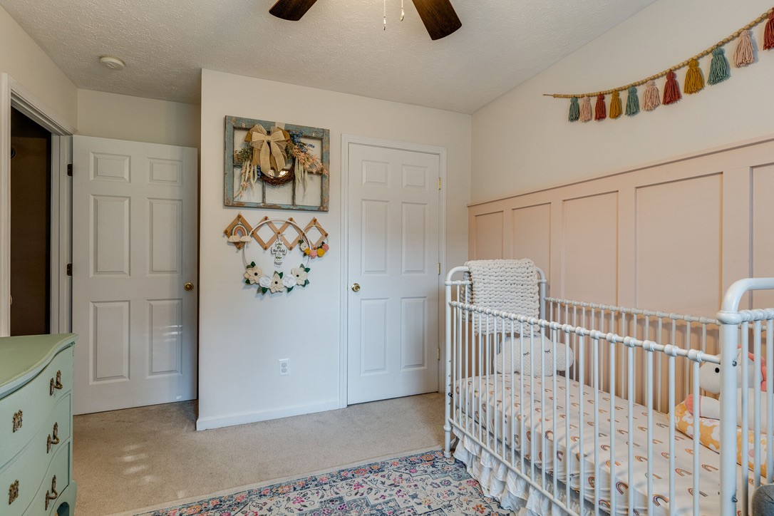 908 Chesire Court White House, TN 37188 - Photo 16 of 20 a bedroom with a bed and wooden floor