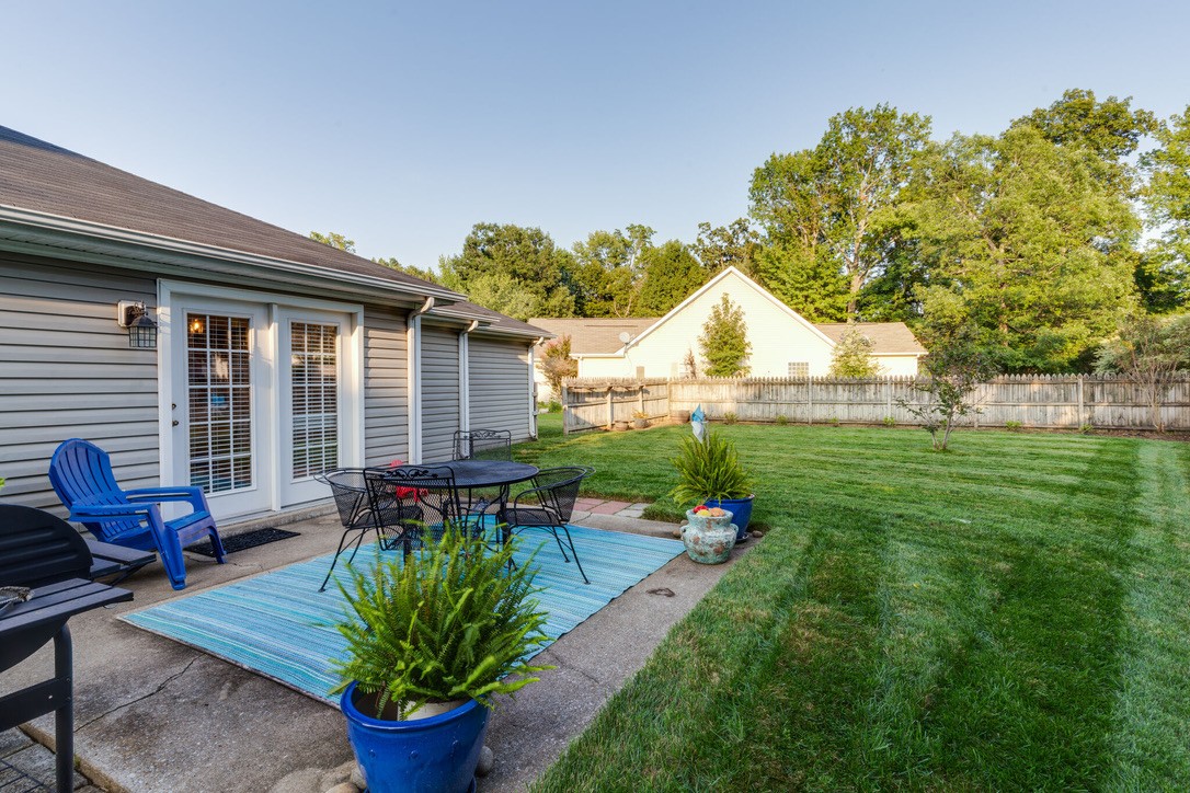 908 Chesire Court White House, TN 37188 - Photo 19 of 20 a view of a house with backyard sitting area and garden