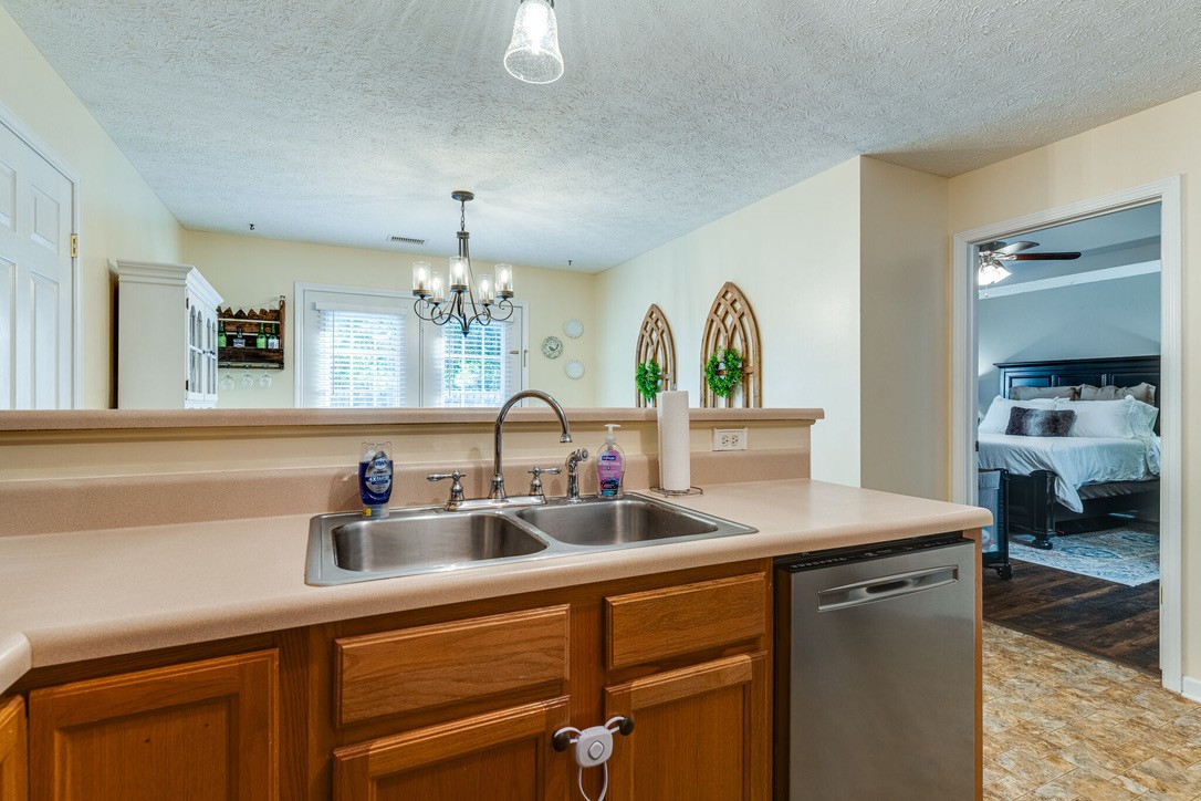 908 Chesire Court White House, TN 37188 - Photo 8 of 20 a kitchen with sink a counter and cabinets