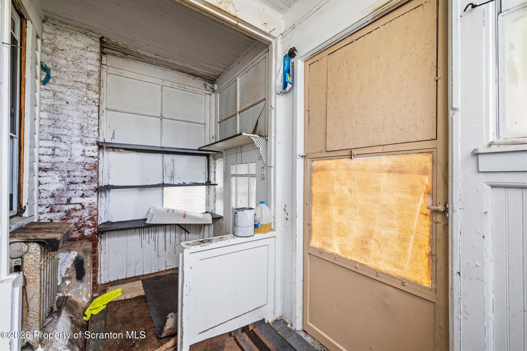 433 Willow Street Scranton, PA 18505 - Photo 14 of 61 a kitchen with a refrigerator and a window