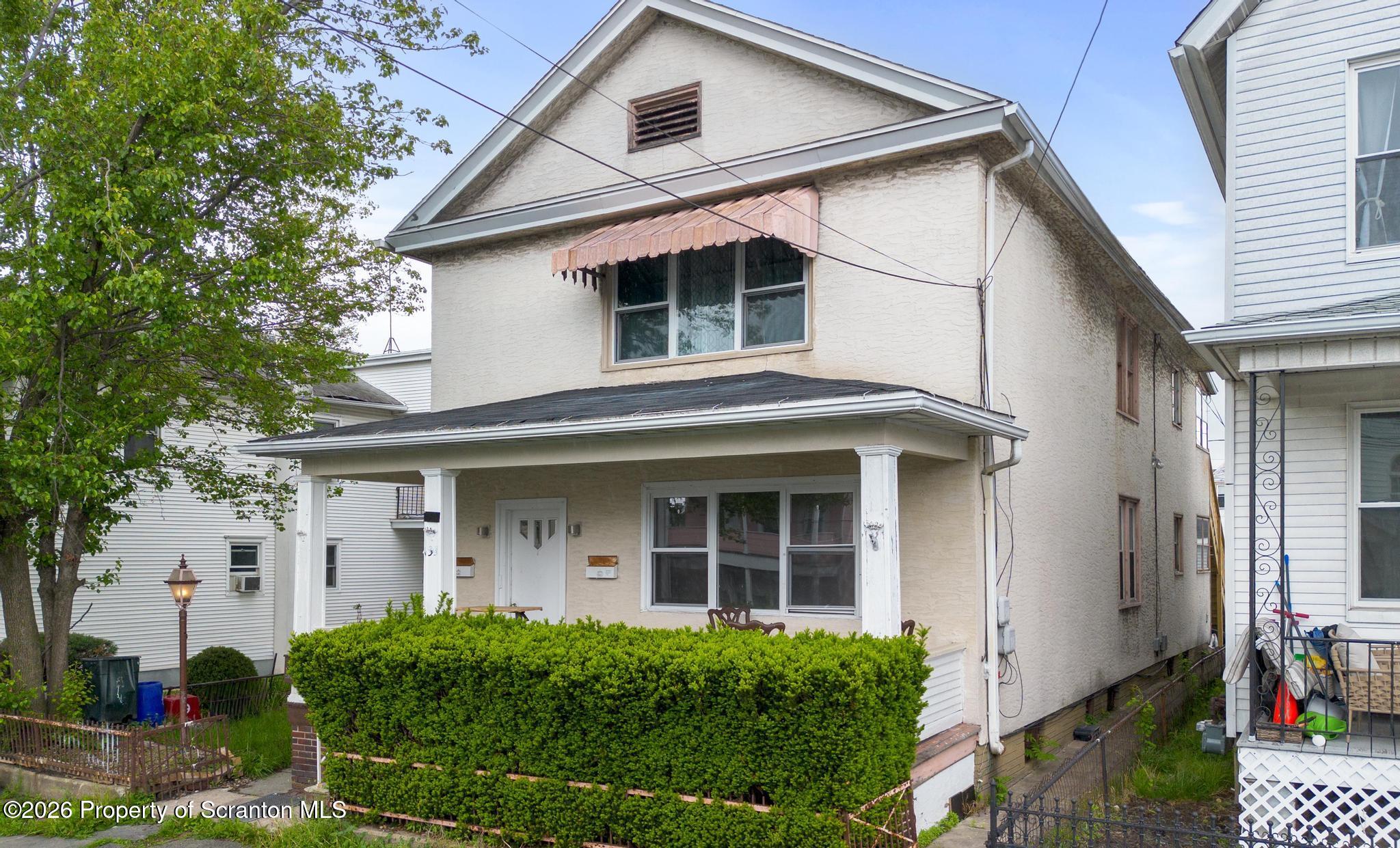 433 Willow Street Scranton, PA 18505 - Photo 2 of 61 a view of white house with large windows and a small yard