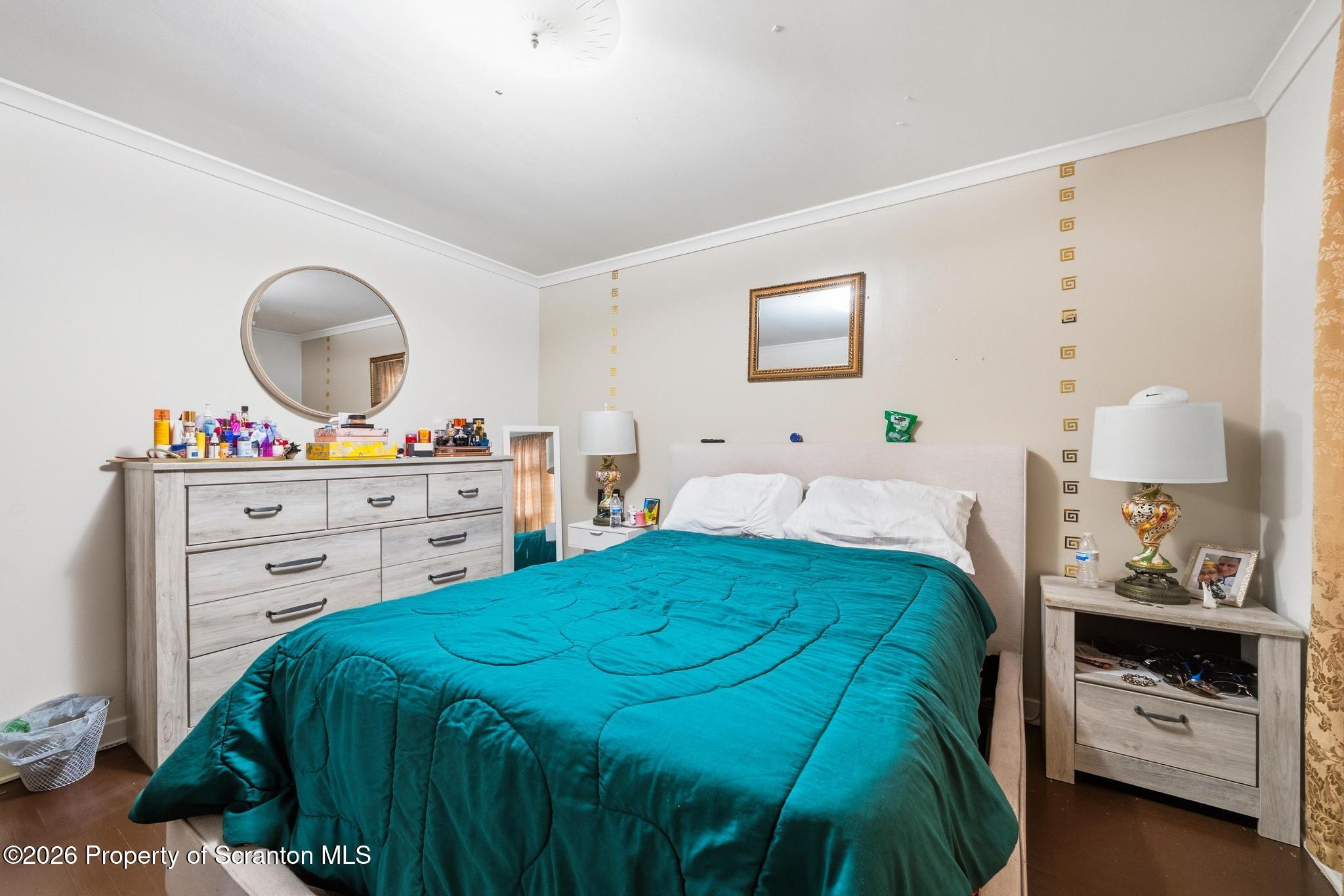 433 Willow Street Scranton, PA 18505 - Photo 25 of 61 a bedroom with a bed and a dresser