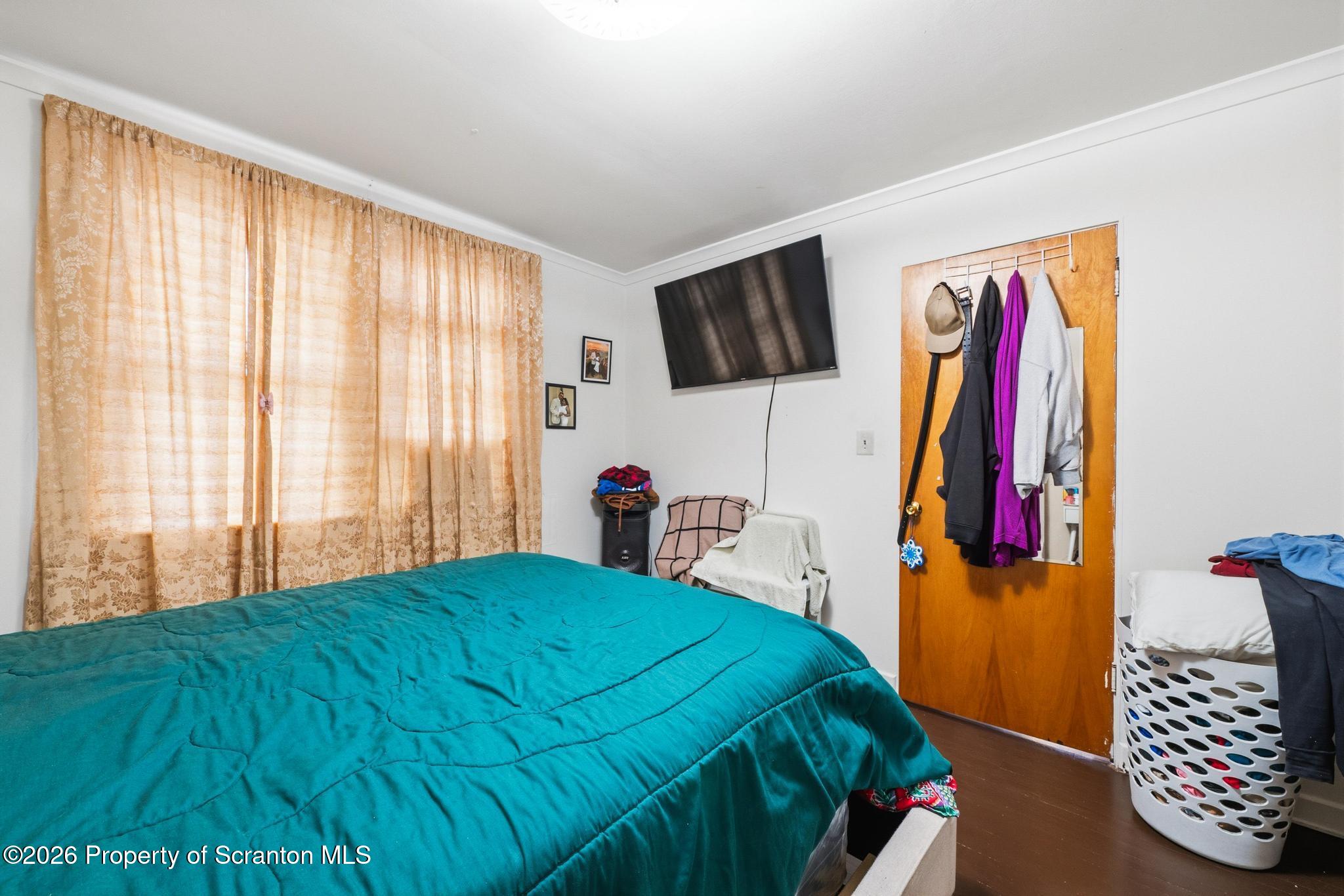 433 Willow Street Scranton, PA 18505 - Photo 26 of 61 a bedroom with a bed and a television