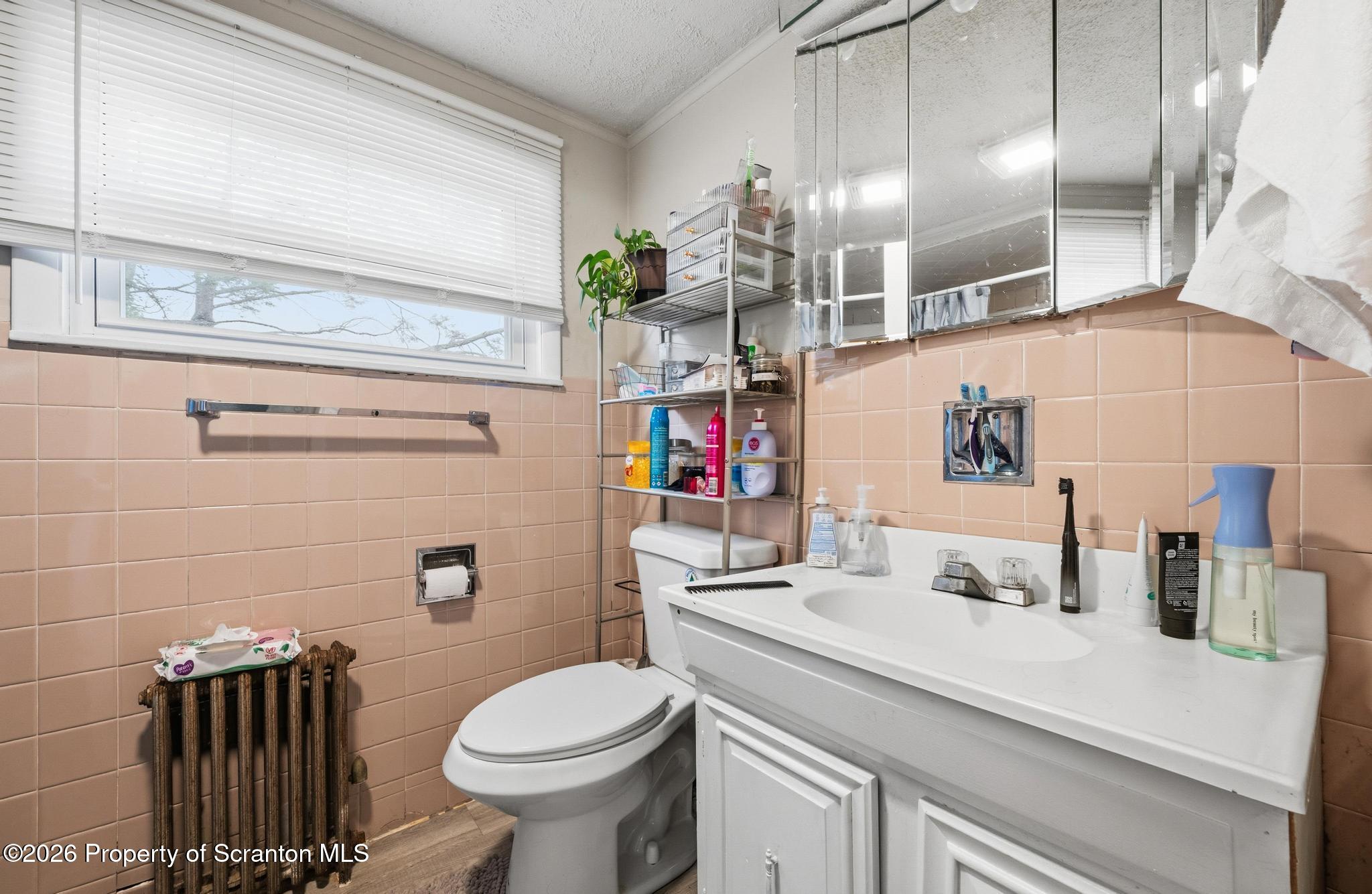 433 Willow Street Scranton, PA 18505 - Photo 35 of 61 a bathroom with a sink toilet and shower