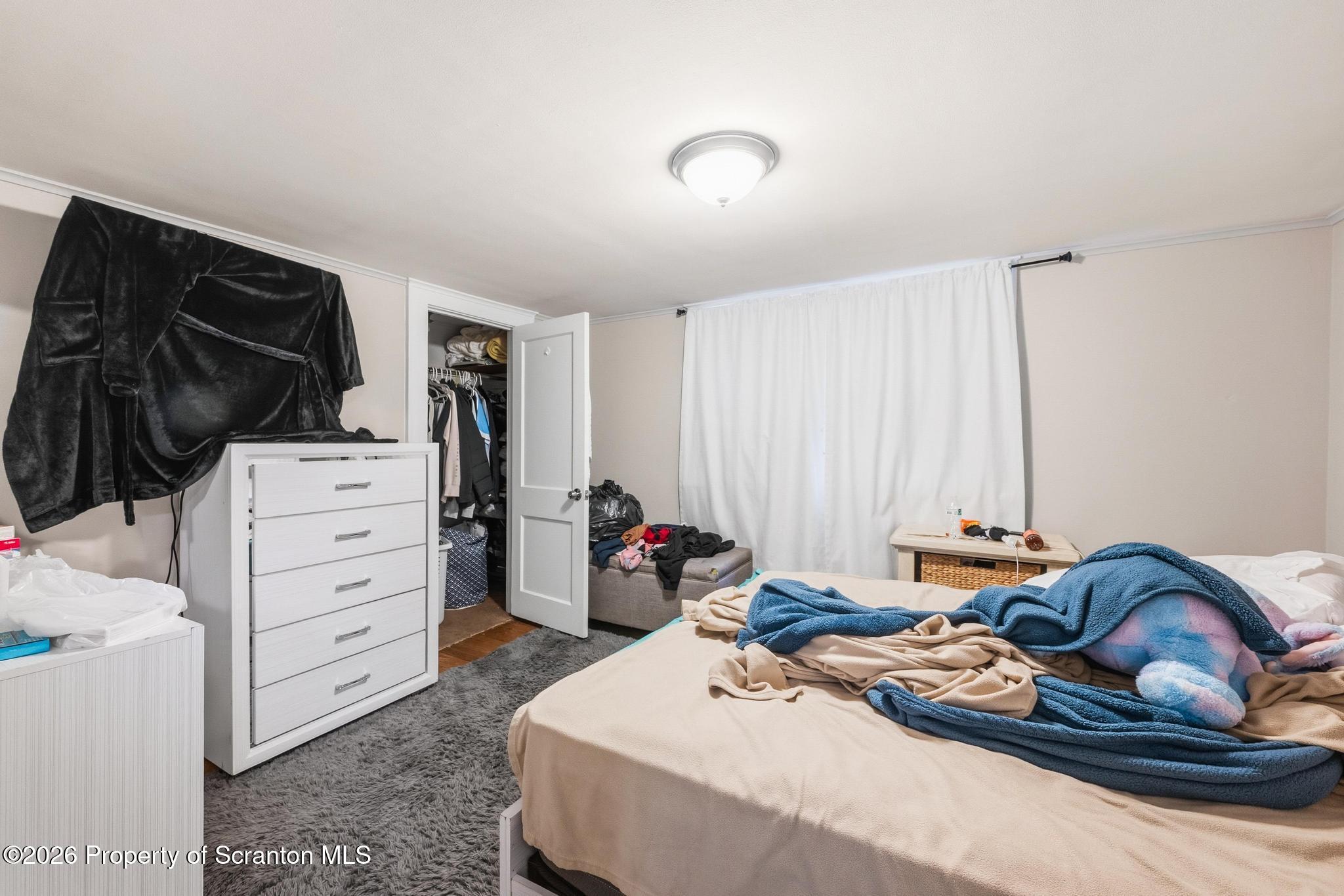 433 Willow Street Scranton, PA 18505 - Photo 39 of 61 a bed room with a bed and a closet