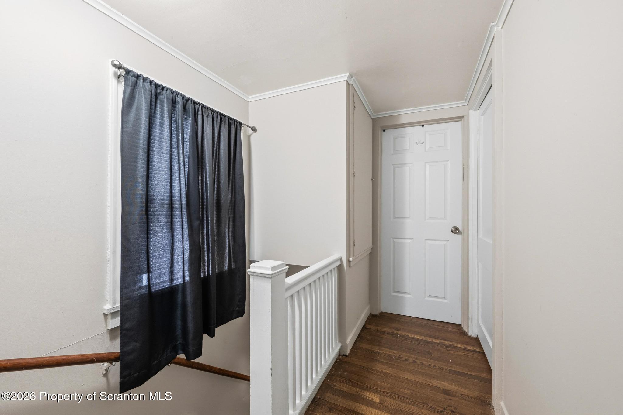 433 Willow Street Scranton, PA 18505 - Photo 41 of 61 a view of a hallway with wooden floor and staircase