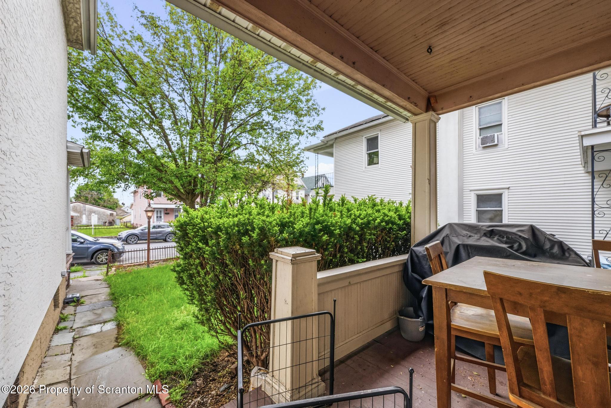 433 Willow Street Scranton, PA 18505 - Photo 43 of 61 a view of a patio with table and chairs and potted plants