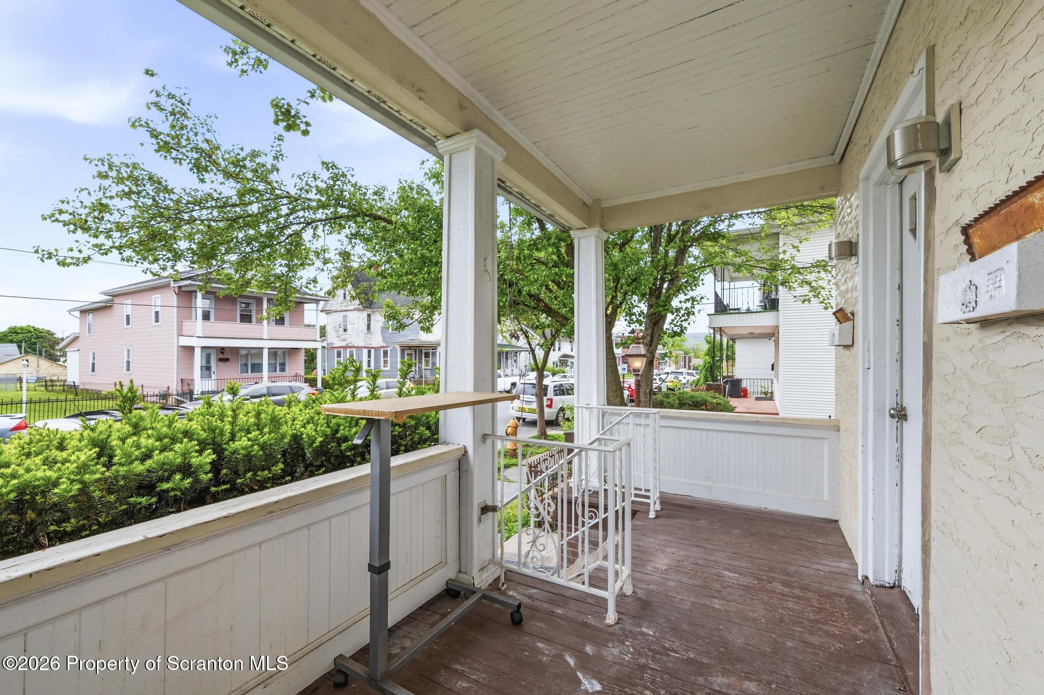 433 Willow Street Scranton, PA 18505 - Photo 51 of 61 a view of a patio with table and chairs and potted plants